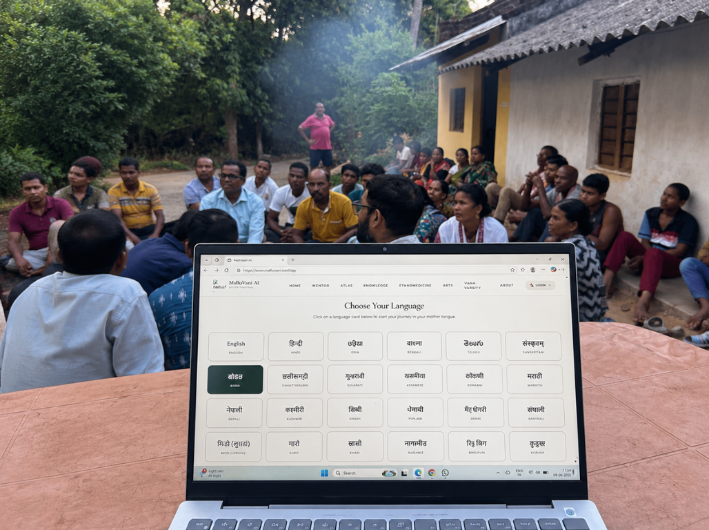 MahulVani AI language chooser shown to a village meeting on a laptop