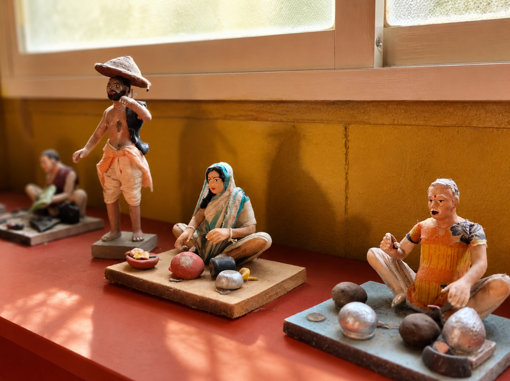 Terracotta figurines of village life on a windowsill