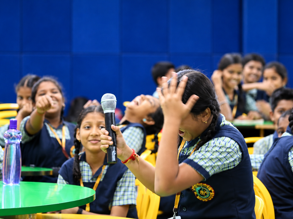 A student speaking into a microphone during a mathematics session