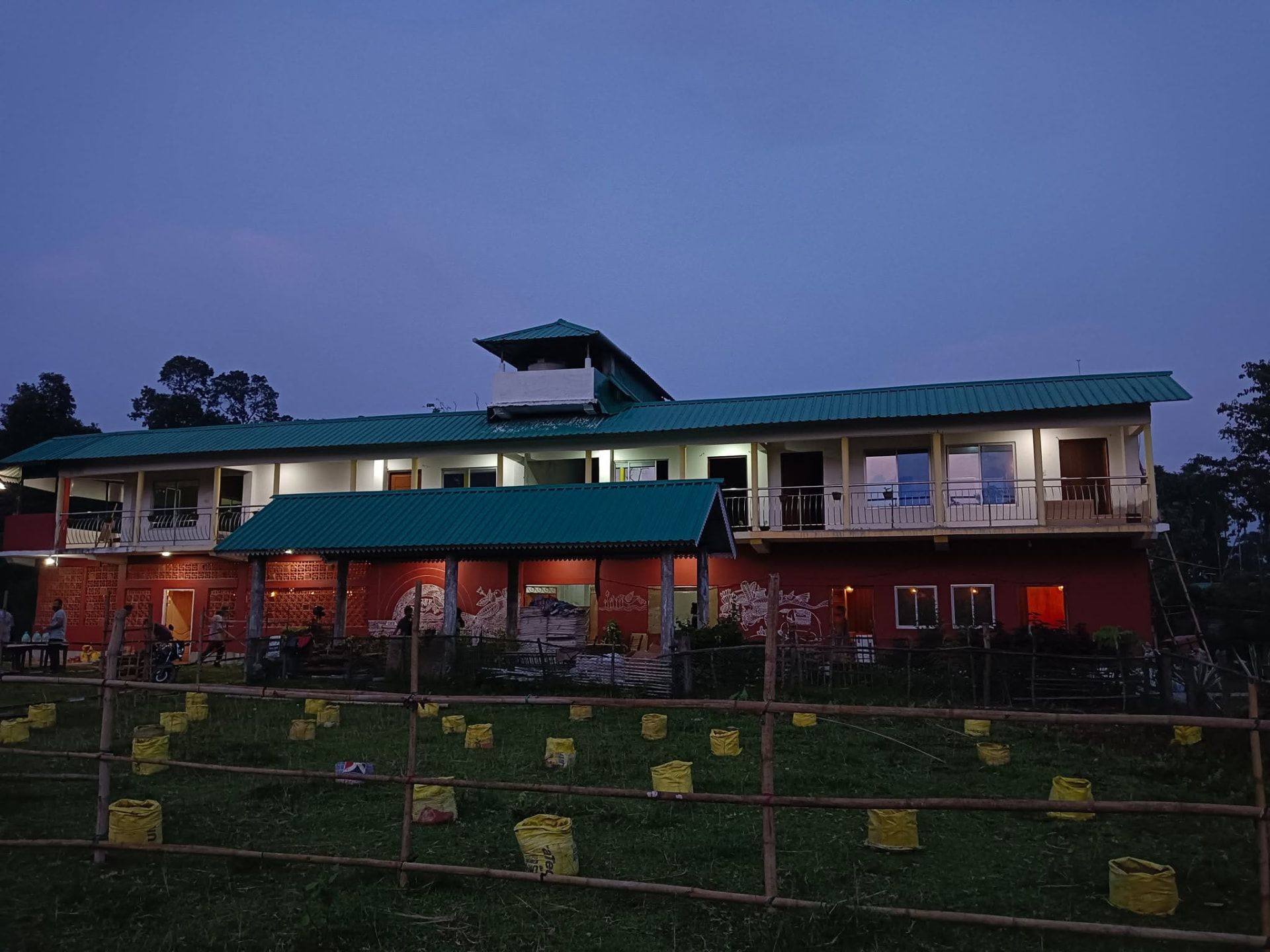 Sack cultivation plots in front of the Terrain Vanabas centre at dusk