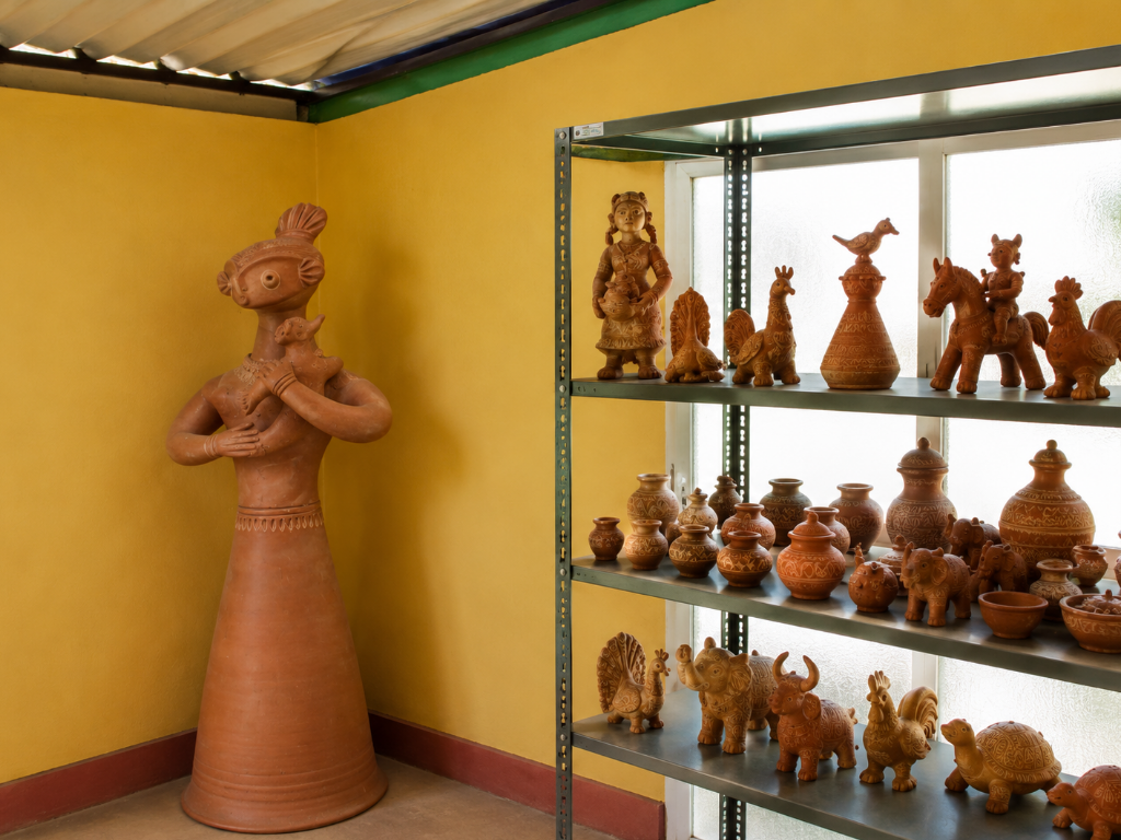 Terracotta figures and pots on display shelves in the cultural archive